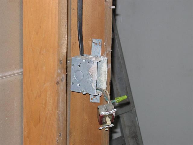 Old spare bedroom wall outlet closeup - notice the quality of the old wood.